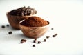 Ingredients for making caffeine drink - coffee beans, ground and instant coffee on light concrete background, copy space