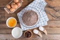 Ingredients for making cake chocolate on a wooden background. Royalty Free Stock Photo