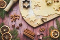 Ingredients for making Christmas cookies. Rolling pin cookie cutters cinnamon flour eggs butter dough on light background with Royalty Free Stock Photo