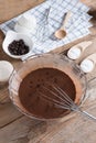 Ingredients for making cup cake chocolate on wooden background. Royalty Free Stock Photo
