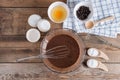 Ingredients for making cup cake chocolate on wooden background. Royalty Free Stock Photo