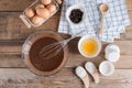 Ingredients for making cup cake chocolate on wooden background. Royalty Free Stock Photo