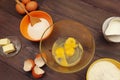 Ingredients for making dough for baking on wooden table Royalty Free Stock Photo