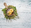 Ingredients making fragrant tea, ginger, lemon, mint and cinnamon, thyme on a white rustic background, top view Royalty Free Stock Photo