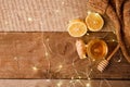 Ginger, honey and lemon, the concept of natural medicine, holiday garland, warm woolen socks, winter cozy home concept