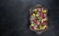 Ingredients for making lemonade Ice cubes, raspberry, lime, lemon and mint, served on old tray over dark rustic Royalty Free Stock Photo