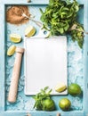 Ingredients for making mojito summer cocktail: chipped ice, mint leaves, brown sugar and lime on turquoise blue painted Royalty Free Stock Photo