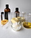 Ingredients for making natural cosmetics cacao butter, coconut, almond, jojoba and essential oils with tubes and bottles Royalty Free Stock Photo