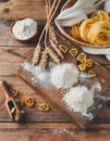 Ingredients for making pasta, flour, on a vintage wooden cutting board Royalty Free Stock Photo