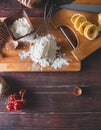 Ingredients for making pasta, flour, on a vintage wooden cutting board Royalty Free Stock Photo