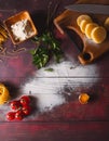 Ingredients for making pasta, flour, on a vintage wooden cutting board Royalty Free Stock Photo