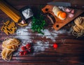 Ingredients for making pasta, flour, on a vintage wooden cutting board Royalty Free Stock Photo