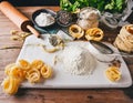 Ingredients for making pasta, flour, on a vintage wooden cutting board Royalty Free Stock Photo