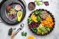 Ingredients for making Quinoa salad on gray background. Vegetable salad in bowl, avocado, sweet potato, beans, herbs. Clean