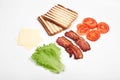 Ingredients for making sandwich. fresh vegetables, tomatoes, bread, becon, cheese. Isolated on white background, top