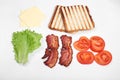 Ingredients for making sandwich. fresh vegetables, tomatoes, bread, becon. Isolated on white background, top view, copy