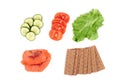 Ingredients for making sandwich. Salmon, fresh vegetables, tomatoes, crispbread,. Isolated on white background,