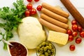 Ingredients for making sausage pizza