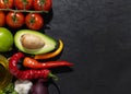 The ingredients for making Spicy Guacamole are avocado, red onion, tomato, chili, lime, cilantro, and garlic. National Royalty Free Stock Photo