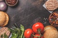 Ingredients for meat burgers on dark background, top view, copy space Royalty Free Stock Photo