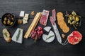 Ingredients for mediterranean food, meat cheede, herbs, on black wooden table, flat lay Royalty Free Stock Photo