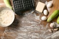 Ingredients and modern maker for preparing of squash waffles on wooden table Royalty Free Stock Photo