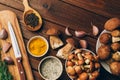 Ingredients for mushroom soup, mushrooms, garlic, spices on wooden table, top view, copy space. Autumn dinner