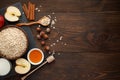 Ingredients for oatmeal on dark wooden table. Concept of healthy food. Royalty Free Stock Photo