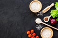 Ingredients for paella on dark background top view