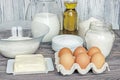 Ingredients for pancakes: milk, eggs, sugar, salt, flour, vegetable oil on a wooden white background. Royalty Free Stock Photo