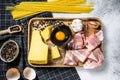 Ingredients for Pasta Carbonara. Traditional Italian food. Gray background. Top view Royalty Free Stock Photo