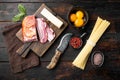 Ingredients for Pasta Carbonara. Traditional Italian food, on old dark  wooden table , top view flat lay Royalty Free Stock Photo