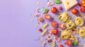 Ingredients with pasta varieties, fresh tomatoes. Purple background. Copy space