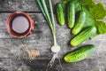 Ingredients for pickled cucumber on wooden table, flatlay