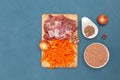 Ingredients for pilaf with lamb meat, top view. Oriental cuisine. Blue background, copy space Royalty Free Stock Photo