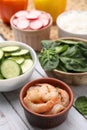 Ingredients for poke bowl on white wooden table