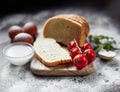 Bread, flour, eggs and cherry tomatoes. Royalty Free Stock Photo