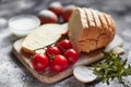 Bread, flour, eggs and cherry tomatoes. Royalty Free Stock Photo