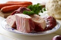 Ingredients for preparation of beef bone broth or soup - marrow bones, parsley, carrots, cauliflower Royalty Free Stock Photo