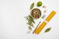 Ingredients for preparation spaghetti with calms or mussels, on white stone table background, top view flat lay, with copy space Royalty Free Stock Photo