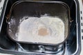 Ingredients for preparing bread in bread pan of electric bread maker Royalty Free Stock Photo