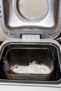 Ingredients for preparing bread in bread pan of electric bread maker Royalty Free Stock Photo