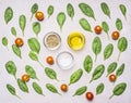 Ingredients for the salad, herbs, oil, pepper, salt and seasonings, on a white rustic background