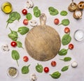 Ingredients for the salad, herbs and seasonings, lined frame on a white rustic background, around the cutting board, frame, space Royalty Free Stock Photo