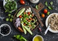 Ingredients for salad - quinoa and vegetables on a dark background