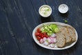 ingredients for sandwiches with cheese, egg, cucumber, radish and cherry tomatoes