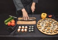 Ingredients for seafood dish.chef cutting vegetables and fish Royalty Free Stock Photo