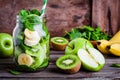 Ingredients for smoothie in jar: banana, kiwi, spinach, green apple Royalty Free Stock Photo