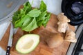 Ingredients for smoothies - kiwi, avocado, spinach and ginger. healthy food Royalty Free Stock Photo