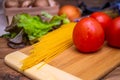 Ingredients for spaghetti on rustic background